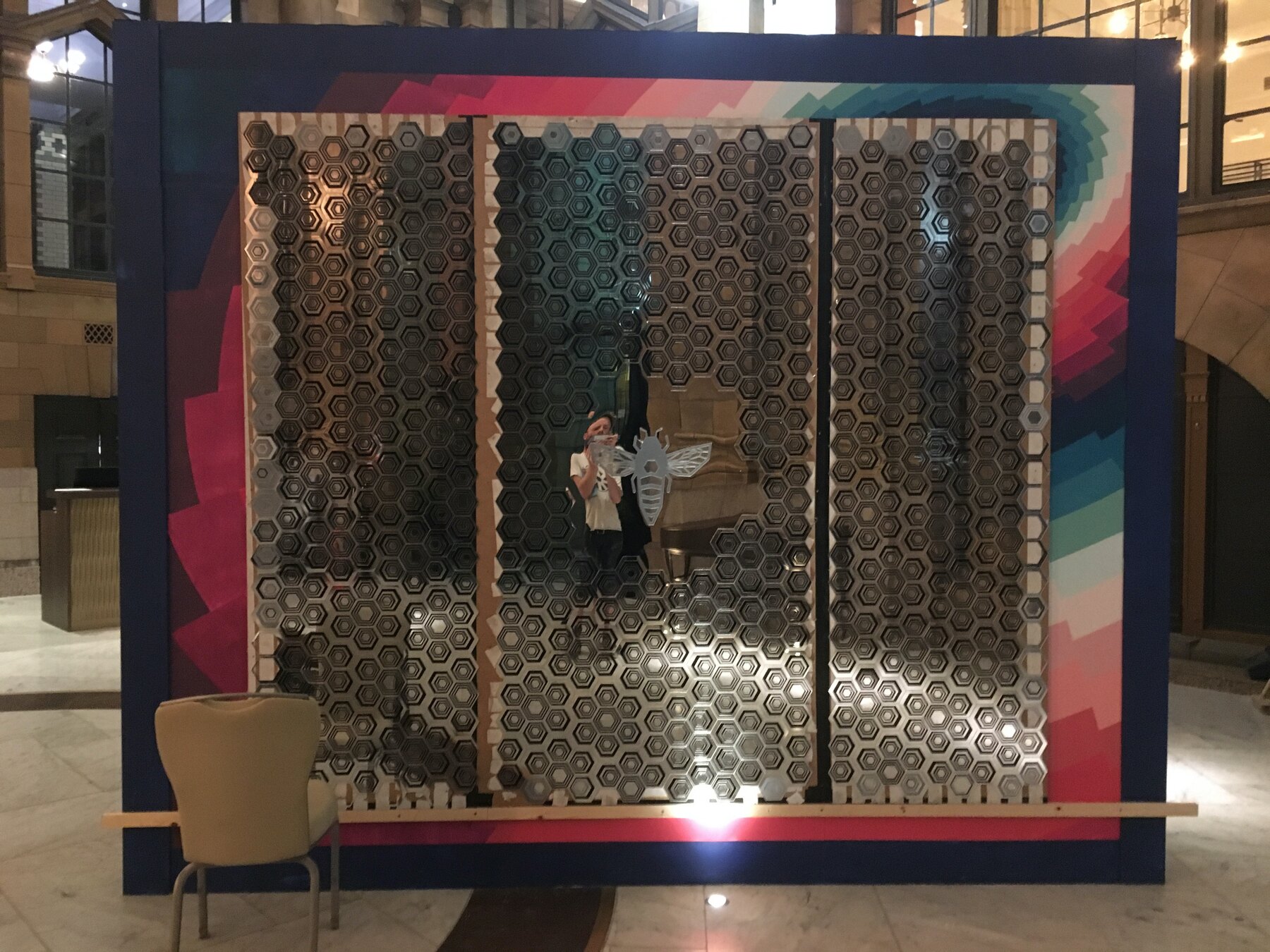 The mirror-clad box in the Palace Hotel reception, hexagons reflecting the room