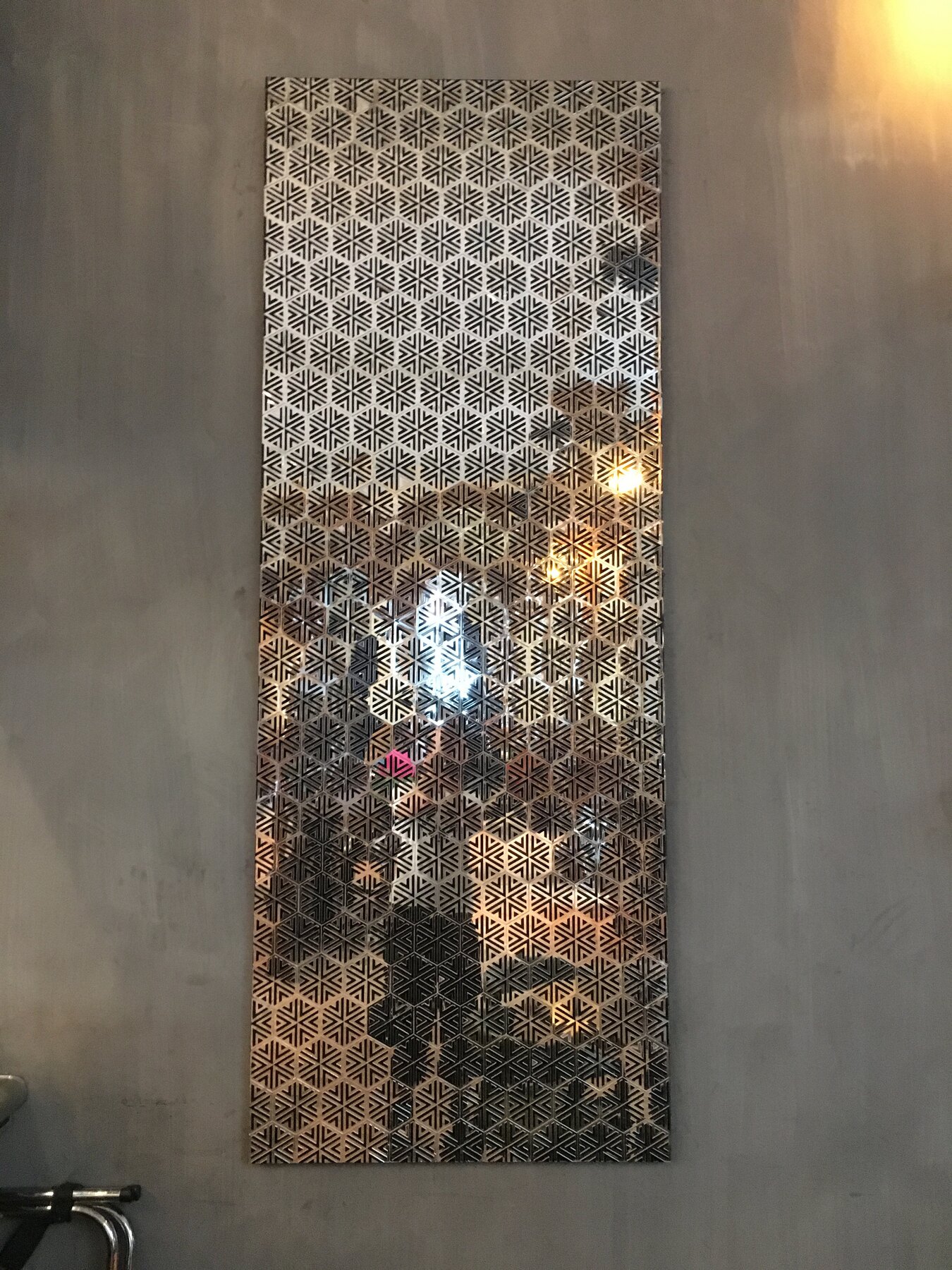 The honeycomb mirror panel in the Refuge dining rooms, 2017