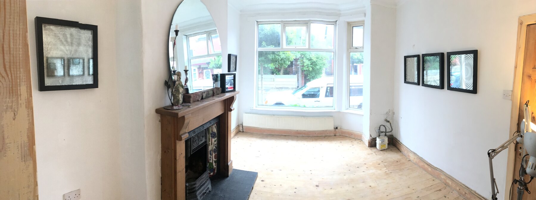 The Open House mirror exhibition in a living room
