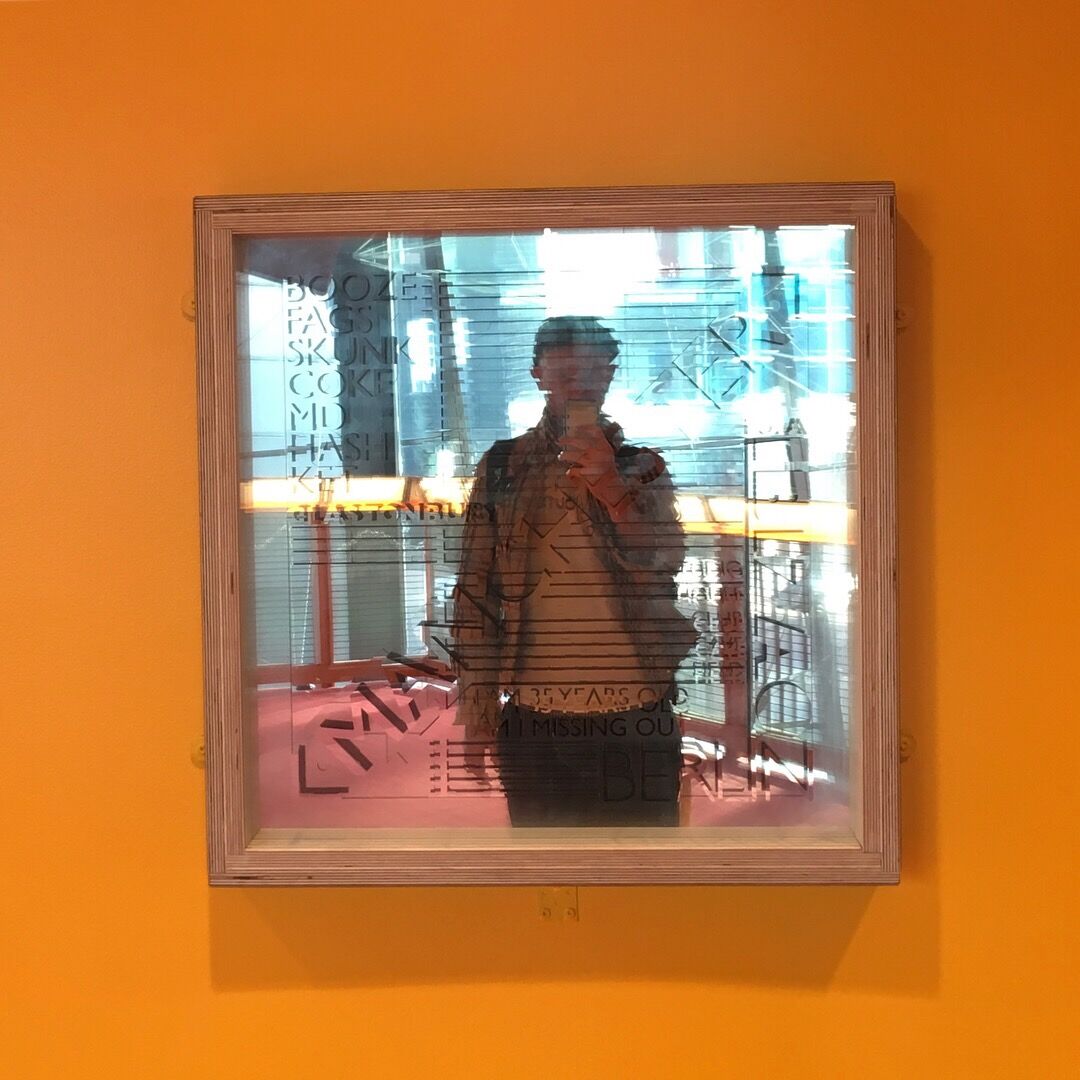 FOMO, an etched mirror, installed at the Lowry