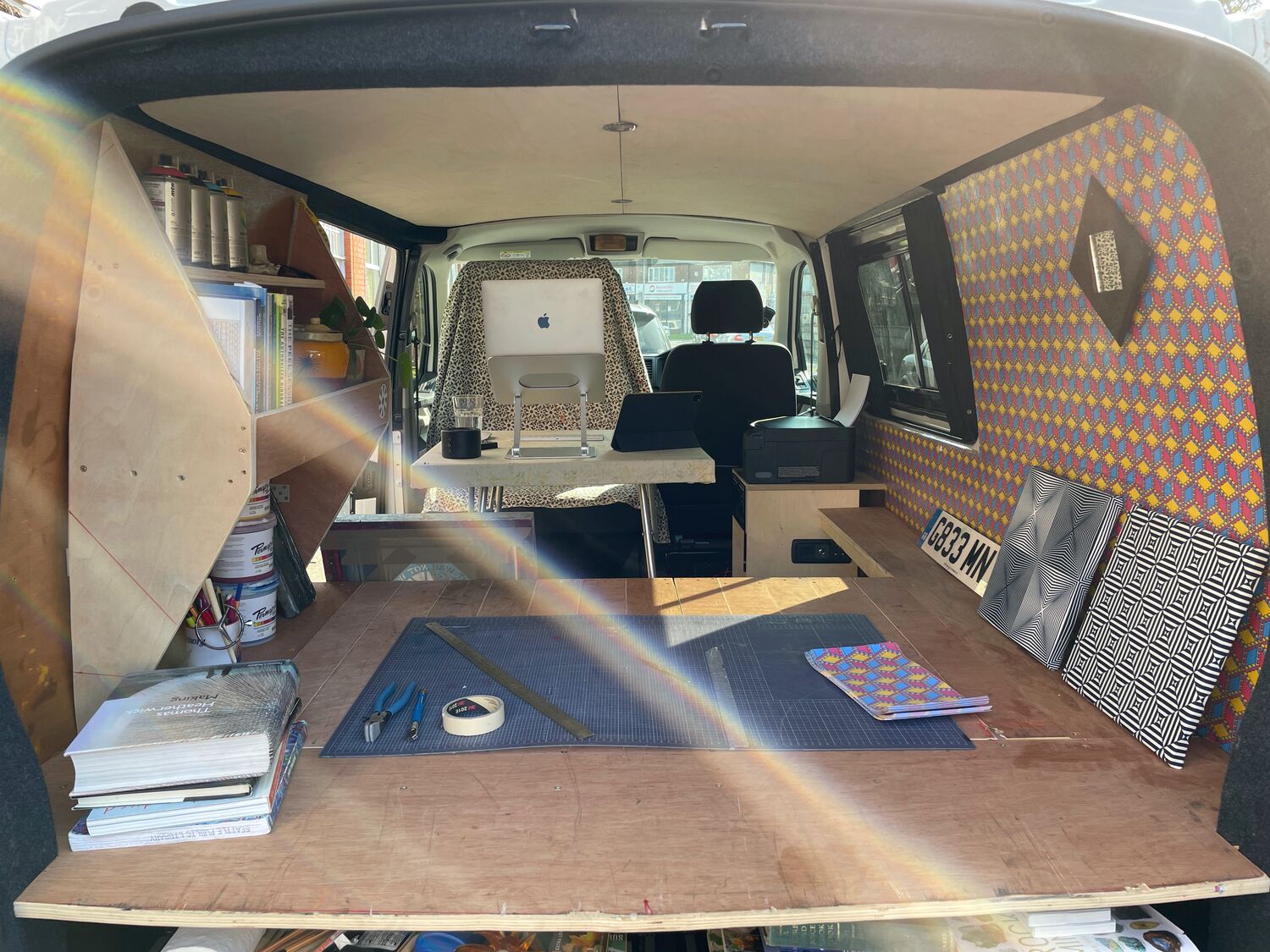 A van lined with the pattern as a mobile studio