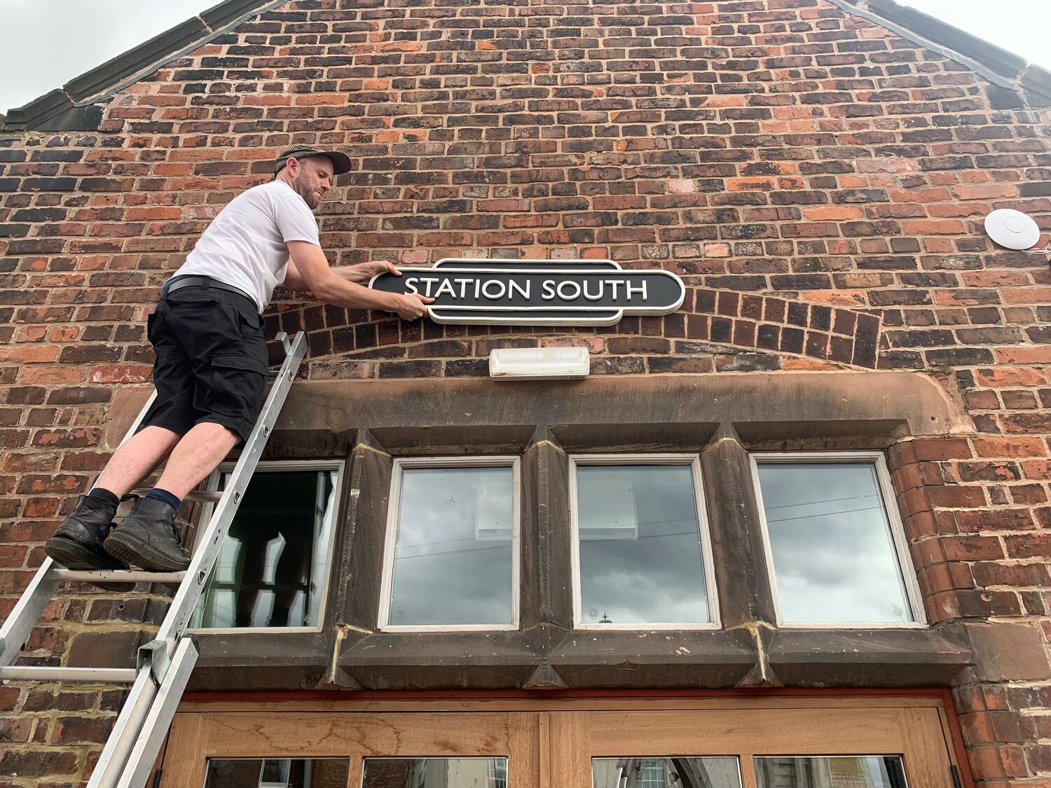 The Station South sign, with my dad, Moderate Studio journal, 2022