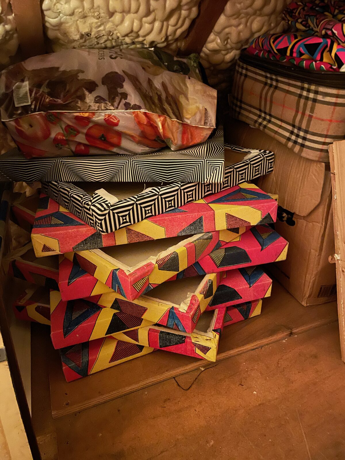Boxes and prints from the one69a archive stacked in the attic.