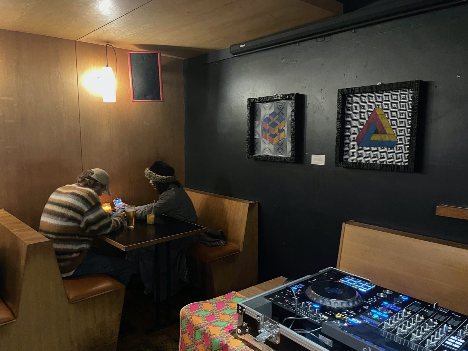 Decks set up among the prints at the Attic Archive opening.