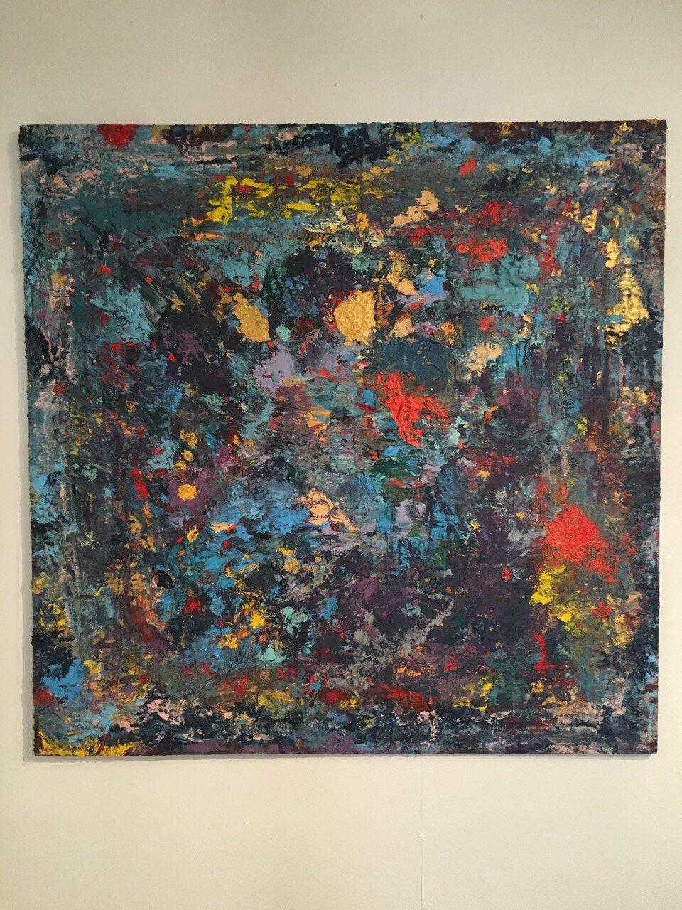 Close view of one of the paintings, dark ground with red, gold leaf and turquoise gesture