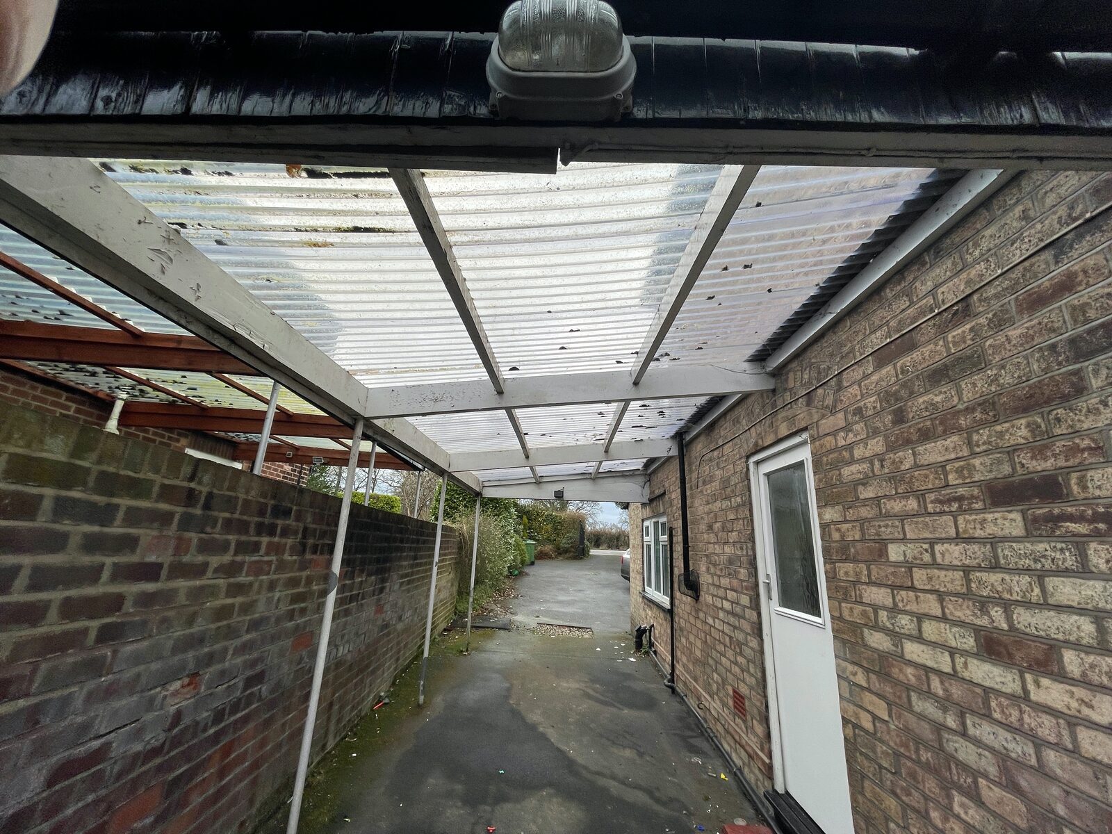 Taking the conservatory apart to reuse the windows and doors.