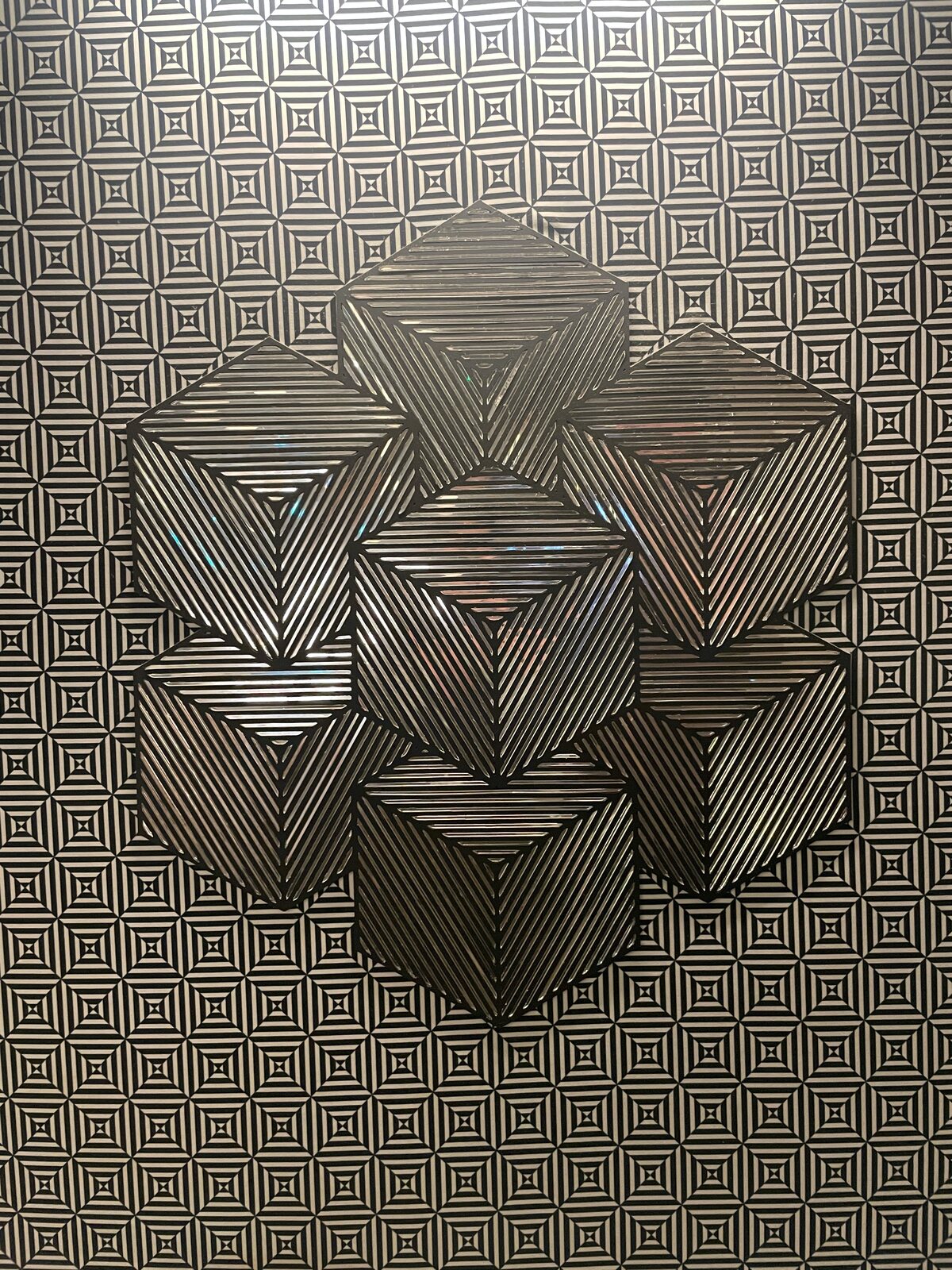 Haunt, a greyscale geometric relief of stacked cubes.