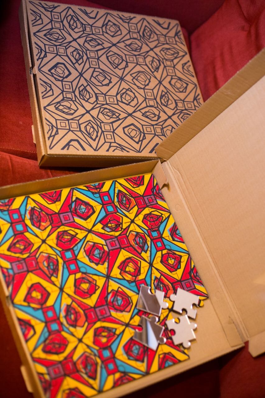 A jigsaw puzzle and its box printed with the Kath Kidston on Acid pattern