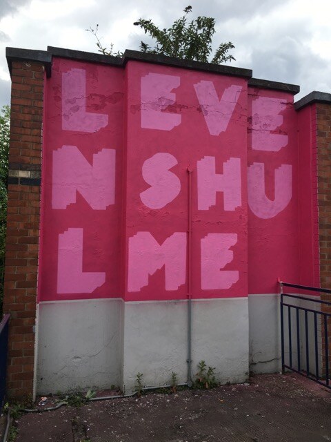 The Levenshulme Station Mural with its letters blocked in, before the outline detail was added