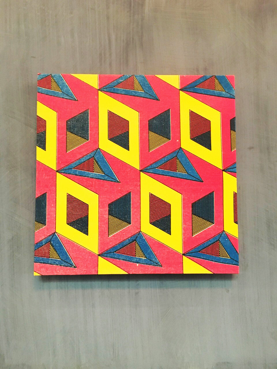 Close-up detail of the isometric cube and diamond pattern used across the Palace Is a Refuge campaign