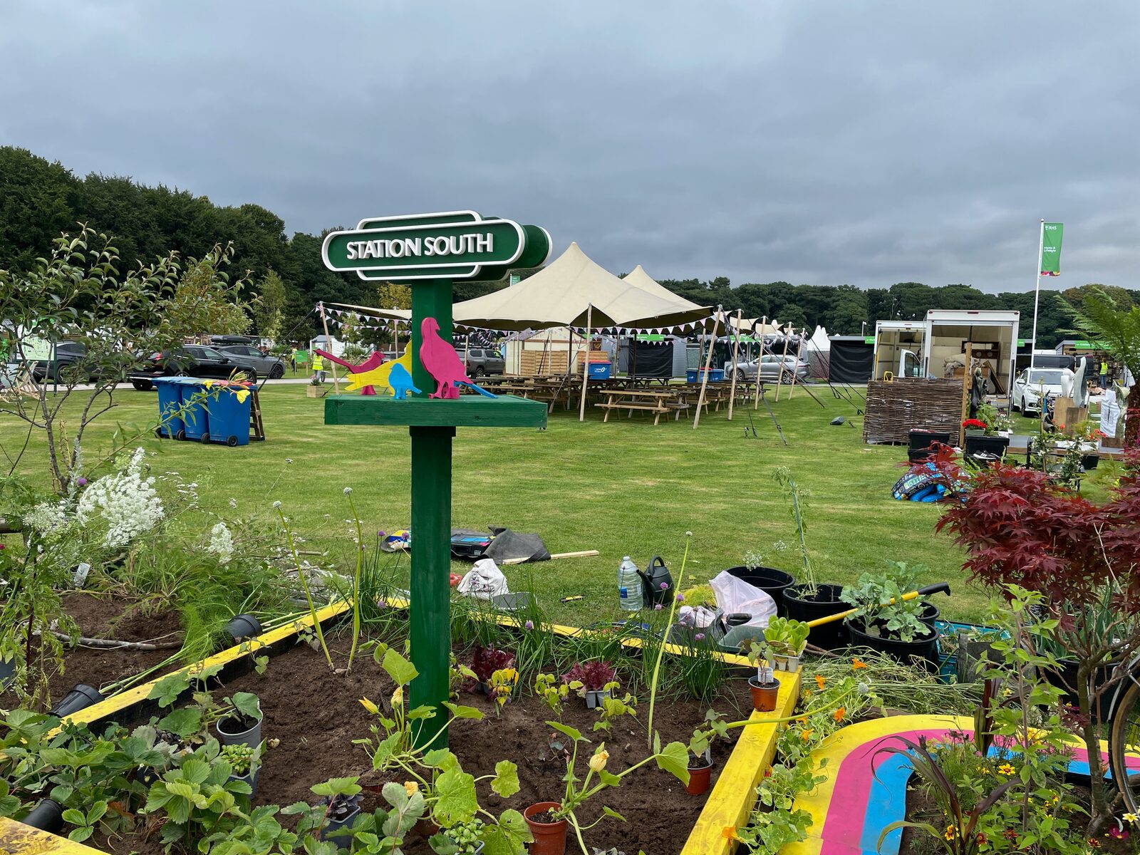 Station South totem sign and painted planting beds at RHS Tatton Park, 2024
