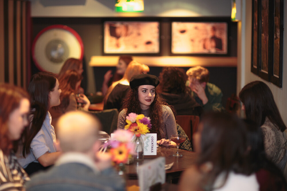 A guest in a beret at the bar during the Vivienne Westwood night