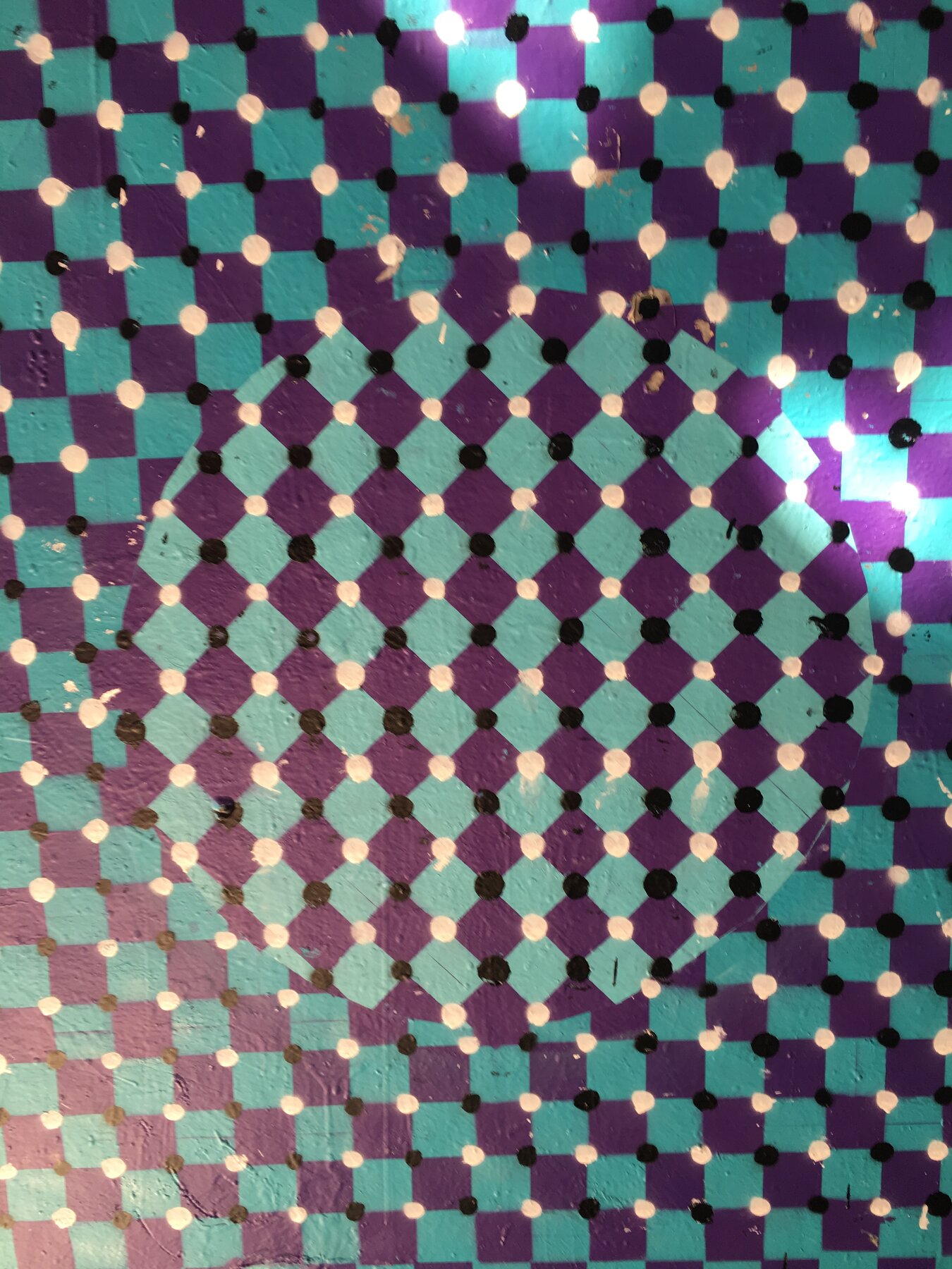 Close-up detail of the checkerboard and diamond dot pattern making up the Waterloo Paint Jam mural
