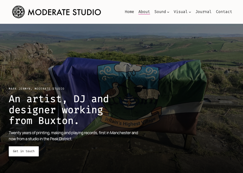 The Moderate Studio About page — 'An artist, DJ and designer working from Buxton,' over a photo of the Flash village flag held up on a moorland hilltop.